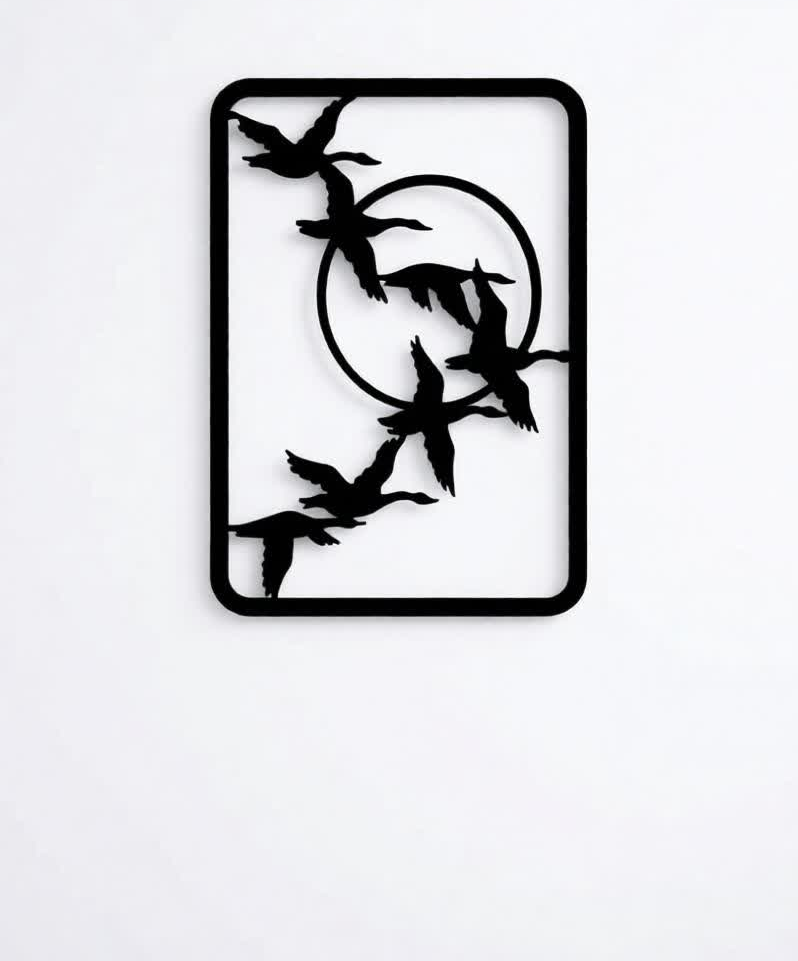 Add a sense of freedom, movement, and modern elegance to your interiors with the Flying Birds CNC Metal Wall Art. This beautifully minimal design features a graceful flock of birds in flight enclosed within a sleek geometric frame, symbolizing freedom, journey, and harmony with nature. Its clean lines and artistic balance make it a perfect statement piece for contemporary spaces. Crafted using advanced CNC laser cutting technology, each bird silhouette is precisely cut to capture natural motion and fine detailing. Made from high-quality metal and finished with a durable matte black powder coating, this wall art offers long-lasting durability while maintaining a refined, modern look. The open-frame structure allows light and shadow to interact with the wall, adding depth without overpowering the space. Whether placed in a living room, hallway, bedroom, or office, this artwork brings a calm and uplifting presence that enhances modern, minimalist, and nature-inspired interiors. Ideal for those who appreciate subtle yet meaningful décor, this CNC metal bird wall art blends simplicity with artistic expression, making it a timeless addition to any setting.