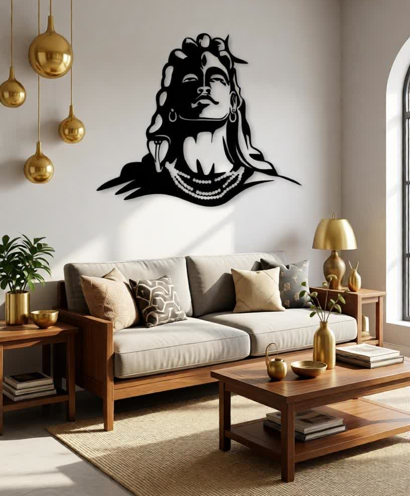 Bring spiritual depth and powerful artistic expression into your space with this Lord Shiva Metal Wall Art. Featuring a striking silhouette of Shiva’s serene face, adorned with symbolic elements such as flowing hair, crescent moon, and sacred ornaments, this artwork represents peace, strength, and divine consciousness. The bold yet minimalist design creates a calming presence while making a strong visual statement. Expertly crafted from high-quality metal, this wall art is precision cut to highlight fine facial details and smooth contours. The matte black powder-coated finish enhances its modern appeal while ensuring durability and long-lasting beauty with minimal maintenance. The clean silhouette design allows it to stand out beautifully against light-colored walls. Perfect for meditation rooms, living spaces, yoga studios, or spiritual corners, this artwork blends devotion with contemporary décor. It harmonizes effortlessly with modern, minimalist, and spiritual interior styles, adding both meaning and elegance to your environment. Designed for easy wall mounting, this piece transforms empty walls into a focal point of calm and inspiration. Whether placed in a personal prayer area or as a statement décor piece, it brings balance, serenity, and artistic sophistication to any space.