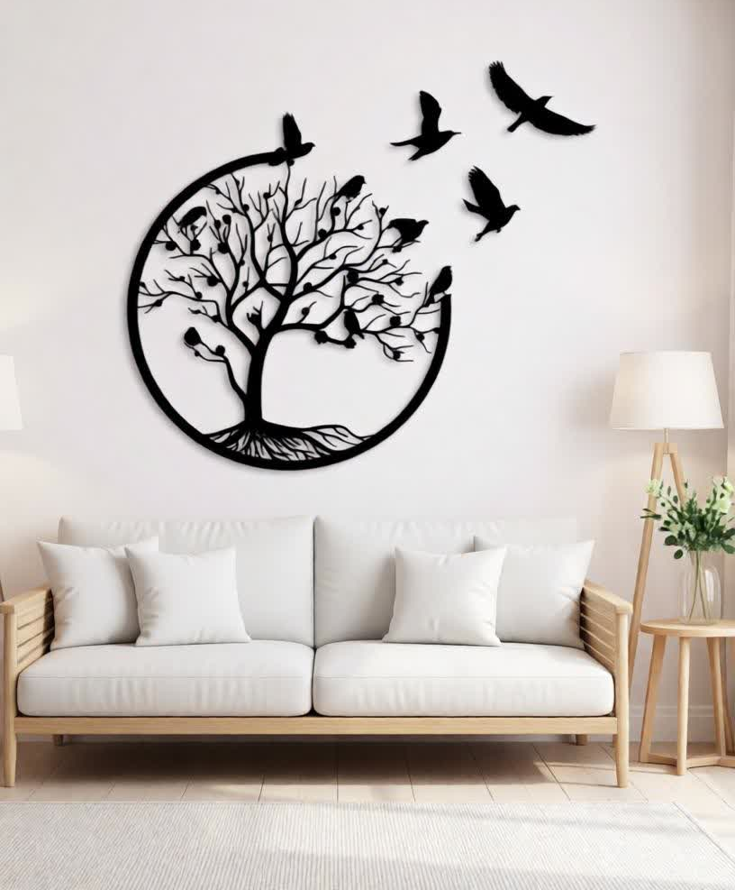 Create a serene and elegant focal point in your space with this Tree of Life with Flying Birds Metal Wall Art. Designed to symbolize growth, harmony, and freedom, this stunning artwork features a beautifully detailed tree enclosed within a circular frame, with birds gracefully flying outward to add movement and visual flow. The balanced composition brings a sense of calm and sophistication to any interior. Crafted from high-quality metal, this wall art is precision cut to capture fine branch details and smooth silhouettes. The matte black powder-coated finish enhances its modern appeal while ensuring durability and long-lasting beauty with minimal maintenance. The contrast between the bold metal design and light-colored walls creates a striking yet soothing visual impact. Perfect for bedrooms, living rooms, lounges, and feature walls, this artwork blends effortlessly with modern, luxury, and contemporary décor styles. Positioned above a bed, sofa, or console table, it transforms empty wall space into an expressive and meaningful design statement. The circular form represents unity and balance, while the birds in flight evoke a sense of freedom and tranquility. Designed for easy wall mounting, this piece offers a clean, floating appearance that enhances the overall ambiance of the room without overpowering it. Whether used in a residential or upscale interior setting, it adds depth, warmth, and artistic charm to your décor.