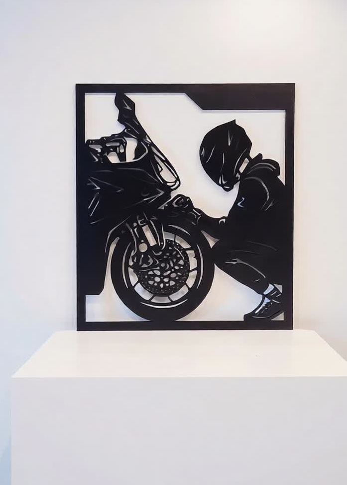 Bring power, passion, and precision to your walls with this Modern Biker CNC Metal Wall Art. Designed for motorcycle lovers and modern interiors, this artwork captures the raw emotion of a rider and machine in a bold, laser-cut silhouette. Crafted from high-quality metal sheet (1–2 mm thickness), the design is both lightweight and exceptionally strong. The precision laser-cut finish highlights fine details while maintaining a sharp, contemporary look. Finished in classic black powder coating, this wall art blends effortlessly with modern, industrial, and minimalist décor styles. Perfect as a statement piece for living rooms, offices, showrooms, garages, or man caves.