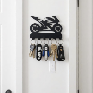Keep your keys organized in style with this Sports Bike Metal Key Holder Wall Art. Featuring a sleek and modern sports bike design, this piece adds a bold and energetic touch to your wall while offering practical functionality. Crafted using precision CNC laser-cut metal, the design showcases sharp detailing and a clean finish. Equipped with sturdy hooks, it allows you to neatly hang your keys, small accessories, or essentials. The matte black finish enhances its modern look, making it perfect for contemporary homes, offices, or bike enthusiasts. This stylish key holder is a perfect blend of décor and utility, ensuring your keys are always easy to find. Ideal For Entryway & Main Door Wall Home & Office Use Garage & Bike Lovers’ Space Gifting for Motorcycle Enthusiasts