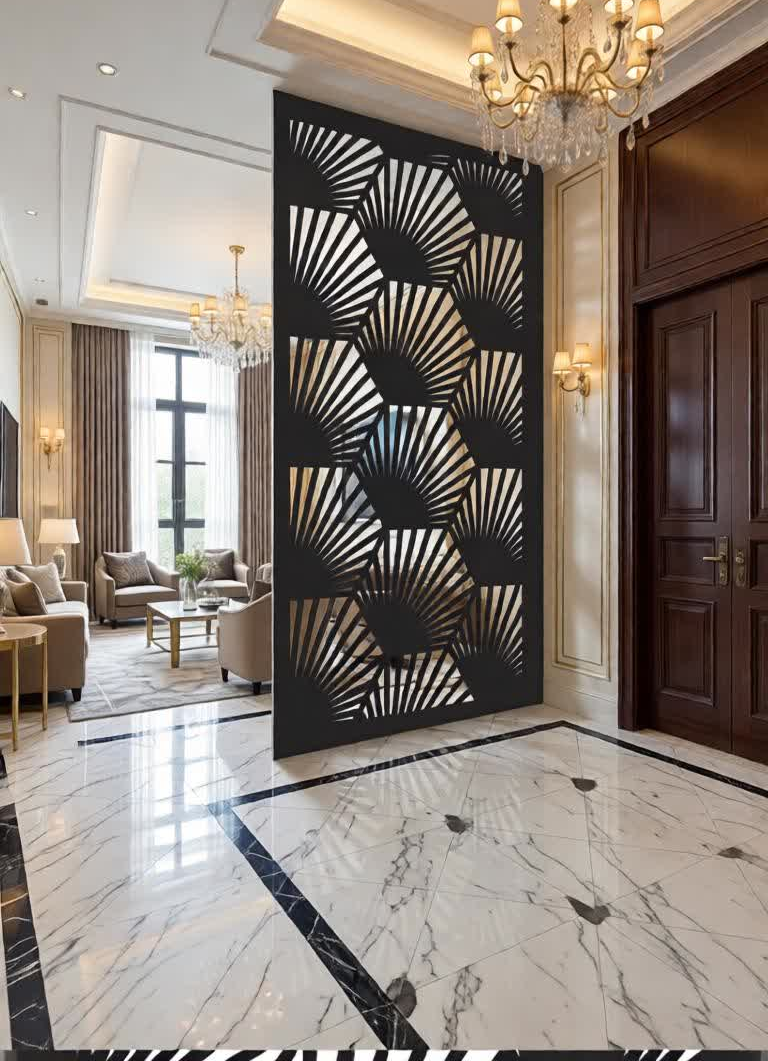 Enhance your interiors with this Modern CNC Laser Cut Jali Partition Panel, a perfect combination of artistic design and functional space separation. Featuring a unique abstract geometric pattern inspired by fan-like and angular shapes, this decorative panel adds depth, texture, and a luxurious feel to any environment. It is ideal for creating stylish partitions without blocking natural light or airflow, making your space look open yet well-defined. Manufactured using advanced CNC laser cutting technology, this partition panel offers precise detailing, smooth edges, and a flawless finish. The intricate cutwork design creates stunning light and shadow effects, adding a dynamic visual element to your interior décor. Whether used in residential or commercial spaces, this panel acts as a statement piece that enhances modern and premium interiors. Constructed from high-quality metal, this jali partition ensures durability, strength, and long-term performance. The powder-coated finish not only provides a sleek and elegant appearance but also protects against rust and wear. Its sturdy build makes it suitable for both permanent and semi-permanent installations. This designer partition panel is highly versatile and can be customized in size, thickness, and color to match your interior theme. It seamlessly complements marble flooring, wooden furniture, chandeliers, and contemporary décor elements, making it a perfect choice for luxury homes and professional spaces.