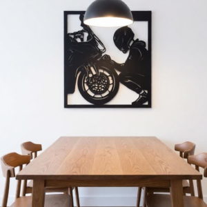 Add a bold and stylish touch to your space with this Motorcycle Rider Metal Wall Art. Featuring a detailed silhouette of a biker working on a motorcycle, this design captures the spirit of speed, passion, and mechanical craftsmanship. Expertly crafted using precision laser-cut metal, the artwork showcases intricate detailing of the bike and rider, creating a striking visual effect. The sleek matte black finish enhances its modern industrial look, making it an ideal décor piece for bike lovers, garages, studios, or contemporary interiors. This unique wall art celebrates the thrill of riding and the love for motorcycles, turning any wall into a powerful statement.