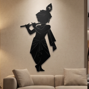 Infuse your home with divine melody and timeless elegance with this Little Krishna Metal Wall Art. Featuring a graceful silhouette of Bal Gopal (Little Krishna) playing his flute, complete with the iconic peacock feather in his turban, this design symbolizes love, peace, and spiritual harmony. The flowing posture and intricate outline create a captivating visual appeal that brings serenity and charm to any space. This wall décor beautifully blends devotion with modern artistry, making it a perfect centerpiece for both contemporary and traditional interiors.