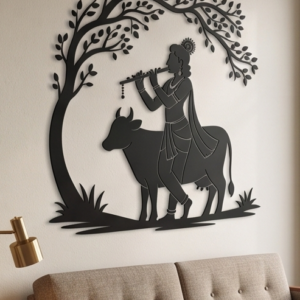 Infuse your home with divine melody and timeless elegance with this Lord Krishna Metal Wall Art. Featuring a graceful silhouette of Lord Krishna playing his flute under a serene tree alongside a devoted cow, this design symbolizes love, peace, and spiritual harmony with nature. The flowing posture and intricate outline of the tree and cow create a captivating visual appeal that brings serenity and charm to any space. This wall décor beautifully blends ancient devotion with modern artistry, making it a perfect centerpiece for both contemporary and traditional interiors.