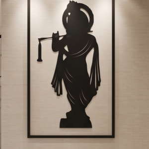 Infuse your home with divine melody and timeless elegance with this Lord Krishna Silhouette Metal Wall Art. Featuring a graceful standing posture of Lord Krishna playing his flute, this design symbolizes love, peace, and spiritual harmony. The flowing robes and intricate outline of the crown and flute create a captivating visual appeal that brings serenity and charm to any space. This wall décor beautifully blends ancient devotion with modern minimalist artistry, making it a perfect centerpiece for both contemporary and traditional interiors.